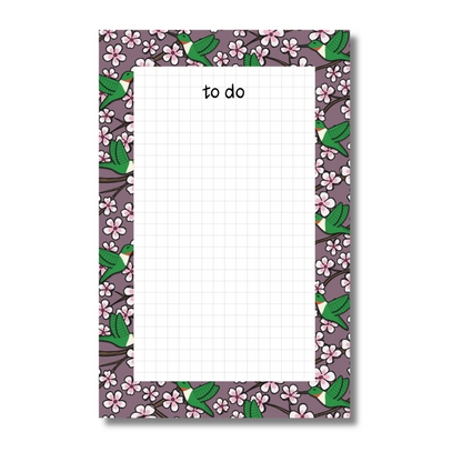 To Do notepad with a hummingbird and cherry blossom border and grid interior on a white background